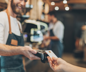Customer paying with NFC payment - tap to pay with ClymbPayments
